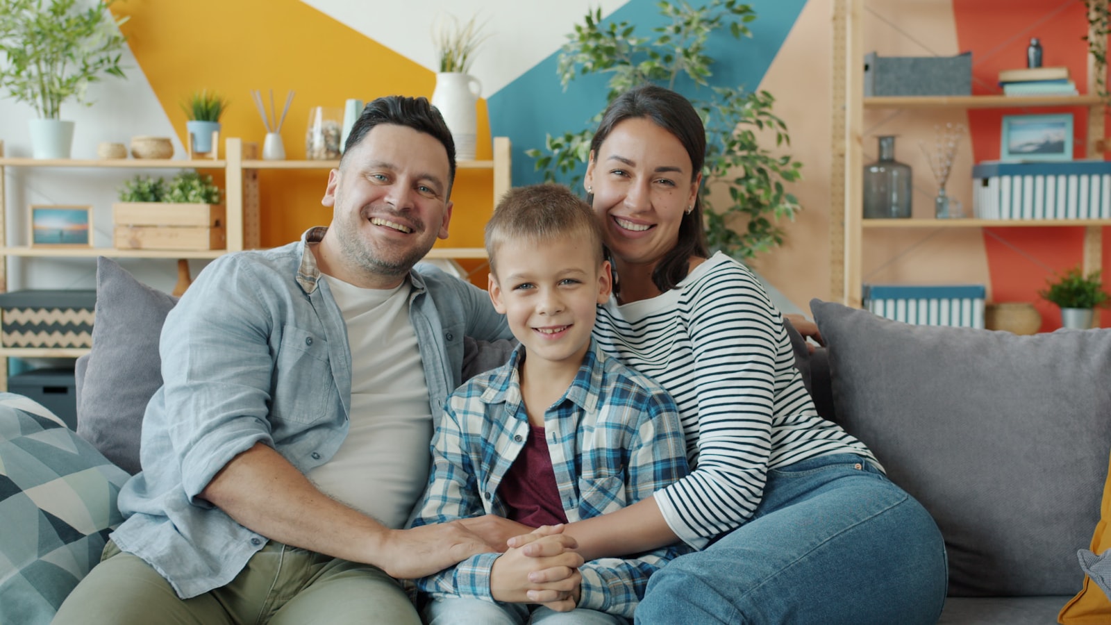 Family smiling together at home